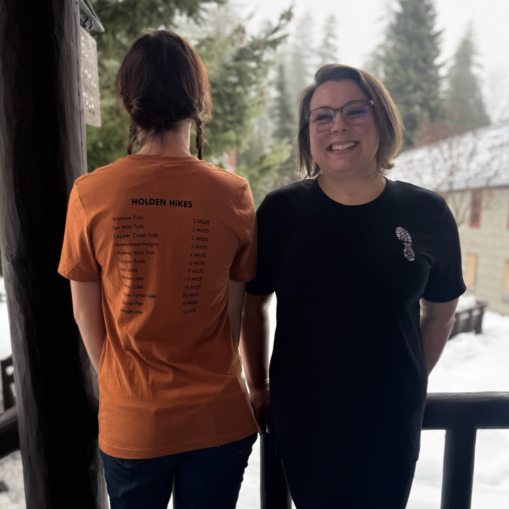 Holden Hikes list (back of shirt) with small boot print on front.