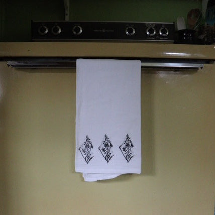 White tea towel w black print