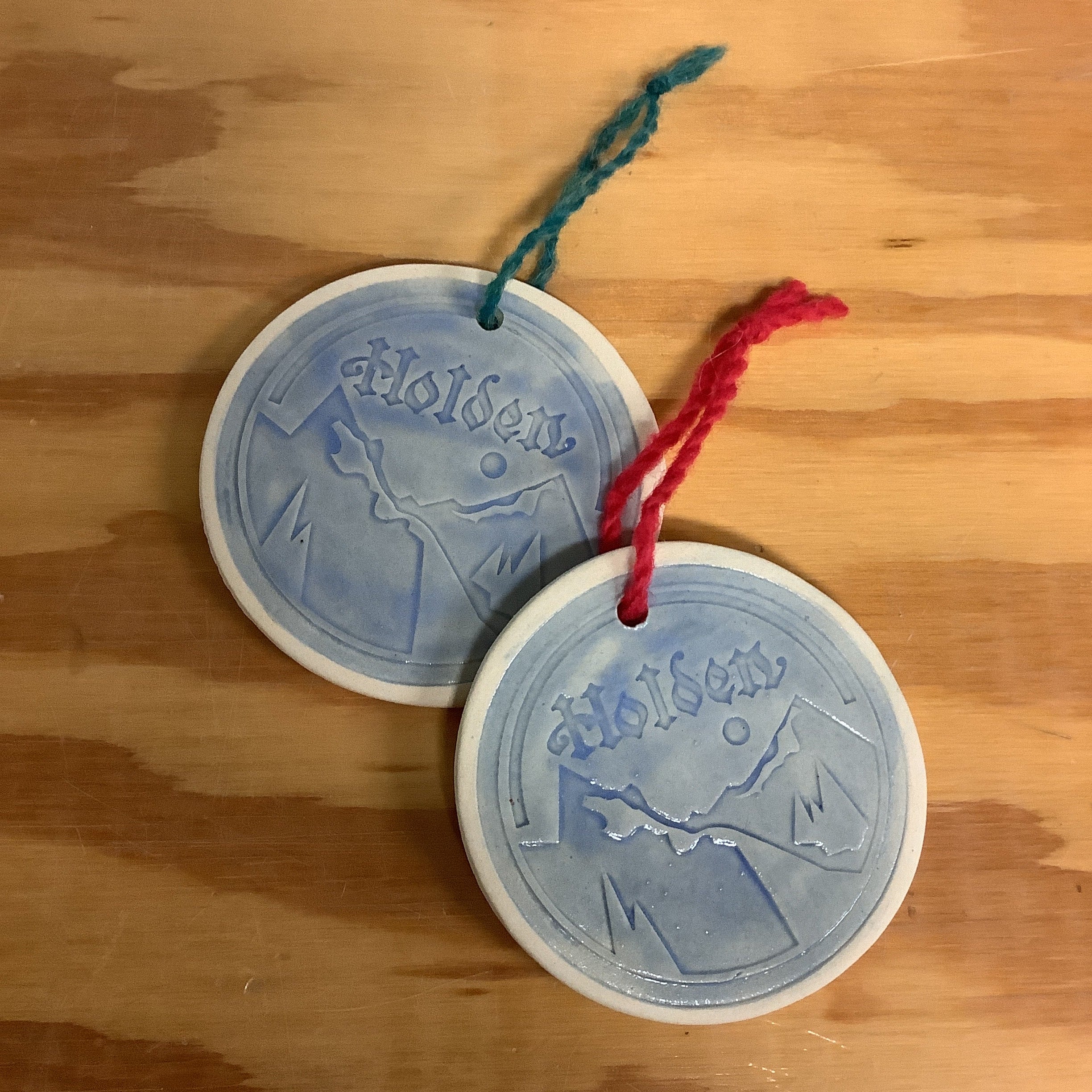 Ceramic ornaments embossed with round Holden Mountain logo